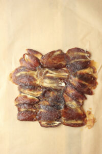 The dates have been flattened on a sheet of parchment paper.