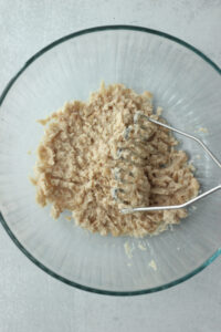 The white beans have been mashed in a large bowl.