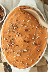 The sweet potatoes have been transferred to a casserole dish and are ready to serve.
