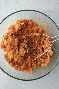 The sweet potatoes have been mashed in the same bowl.