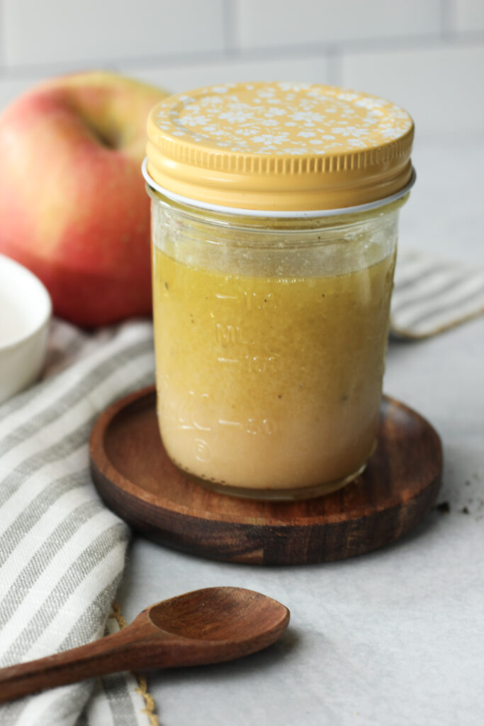 An up-close picture of this vinaigrette in a mason jar.