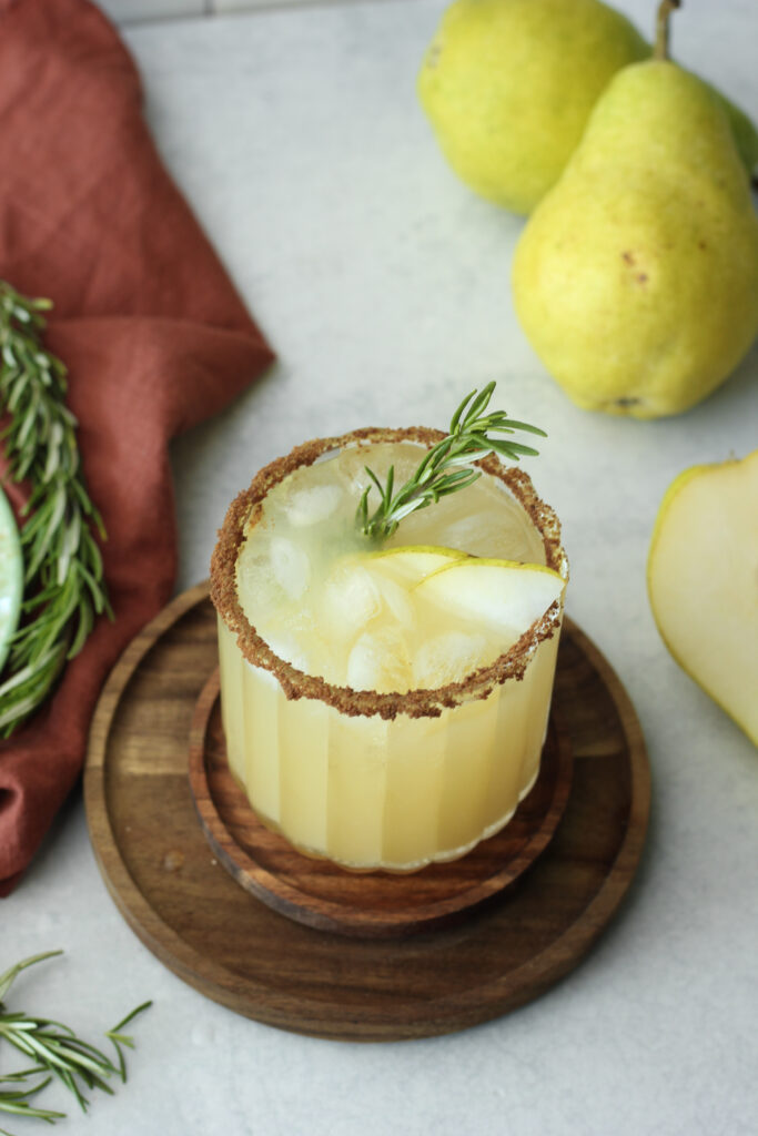 The mocktail is ready over ice in a clear glass cup.