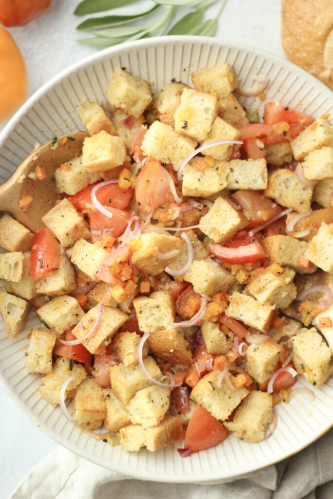 The panzanella salad is in a large bowl and is ready to eat.