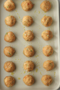 The balls of dough have been placed on the baking sheet.