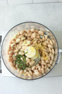 All of the ingredients are in the food processor and are ready to blend.