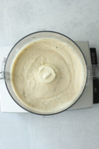 The bean mixture has been blended and is smooth and creamy.