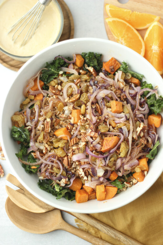 The dressing is ready to pour over the large salad.