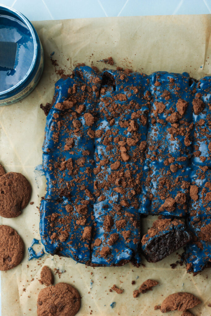 The brownies have been frosted and cut into pieces.