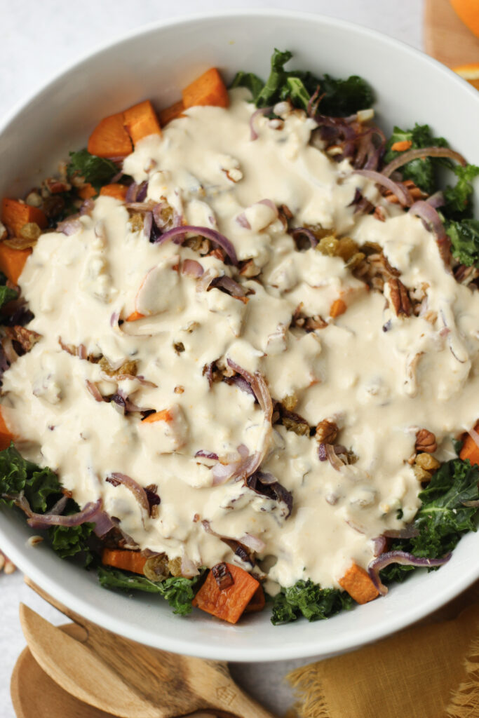 The dressing has been poured over the salad.