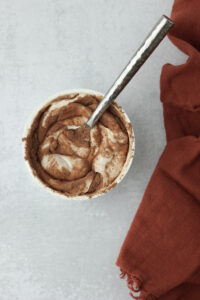 Mixing the ingredients into a yogurt cup.