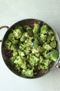 The broccoli and sauce ingredients have been added to the pan.