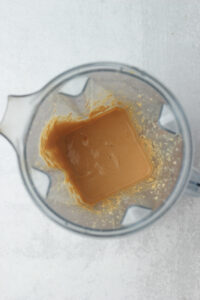 The cashew tomato sauce has been blended in a blender.