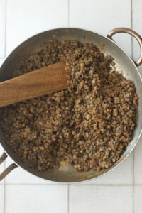 The lentils and seasonings have been cooked in a pan.