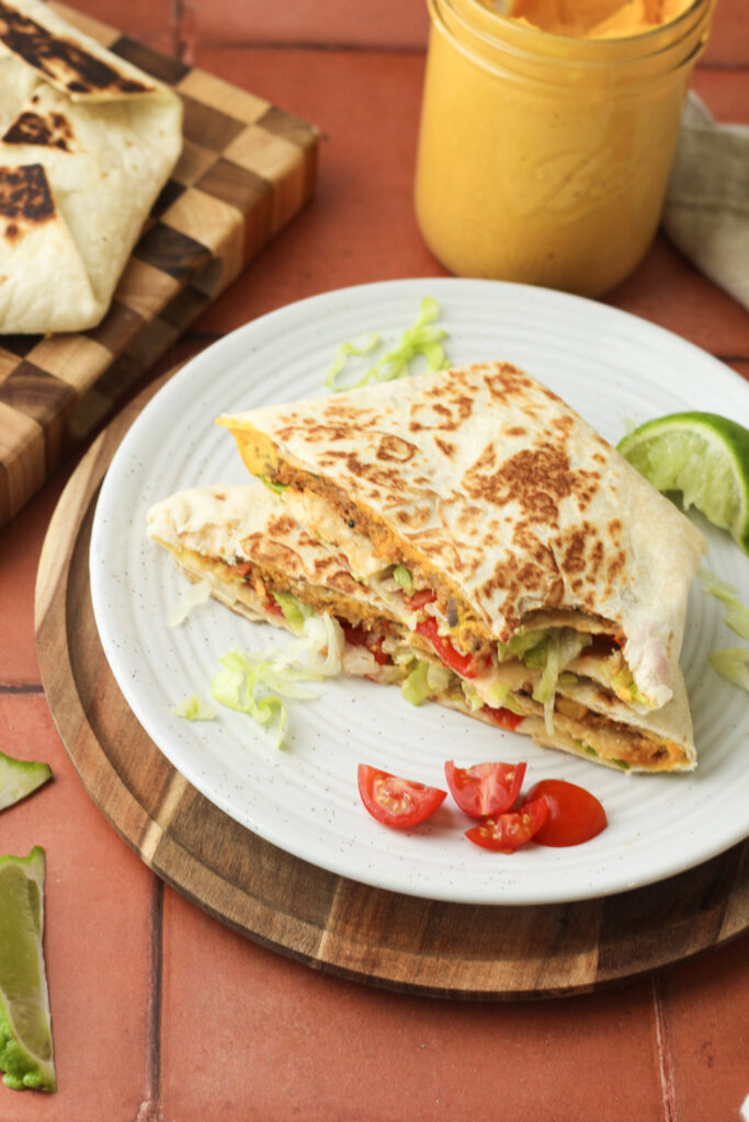 A bite out of one of the vegan Crunchwrap Supremes.