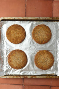 The veggie patties have been cooked on a sheet pan.