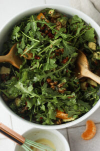 The vinaigrette has been poured over the salad.