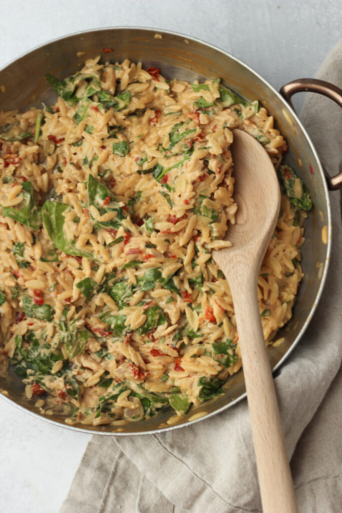 The orzo is in a frying pan and is all ready to enjoy.