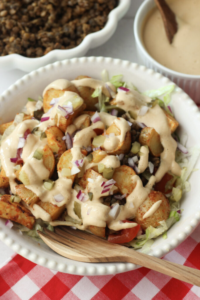 An up-close picture of this Big Mac salad in a white bowl.