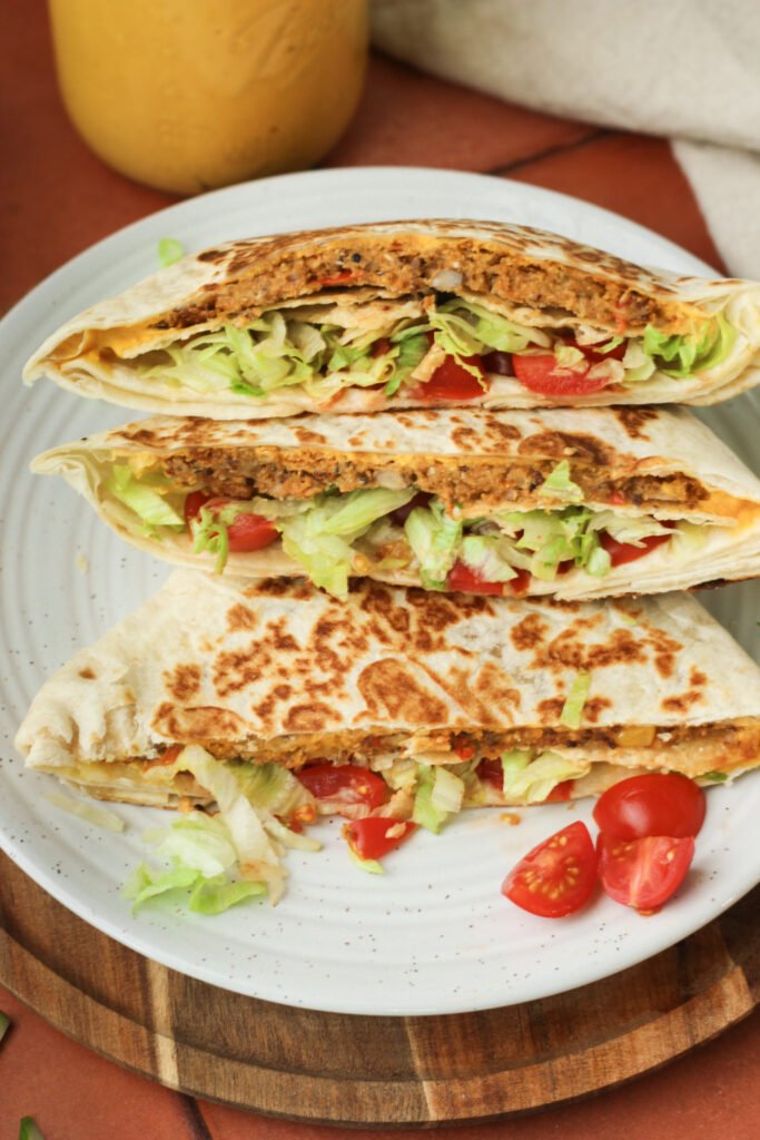 A plate of halved Crunchwraps.