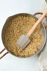 The quinoa has been cooked in a saucepan.