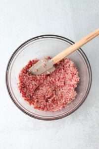 All of the coconut mixture ingredients have been mixed together in a glass mixing bowl.