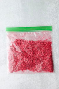 The freeze-dried strawberries have been crushed in a Ziplock bag.