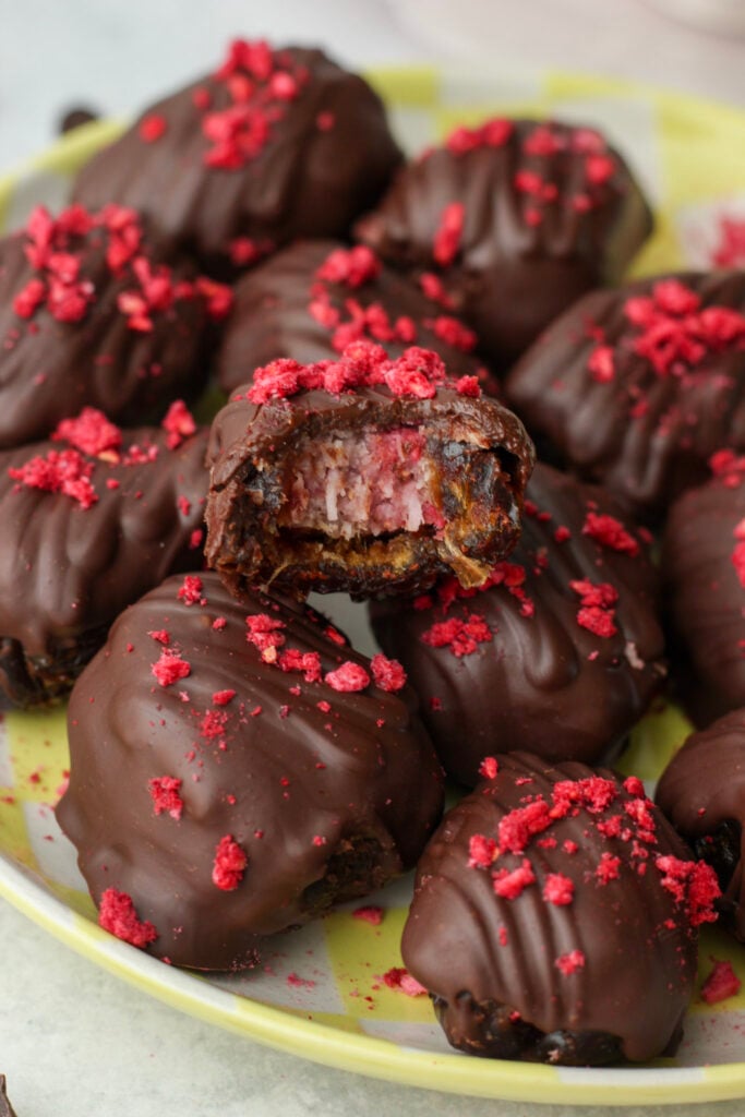 A bite out of these raspberry coconut stuffed dates.