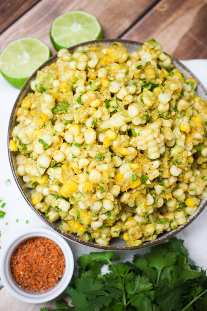 Vegan street corn guacamole salad with avocado and fresh corn.
