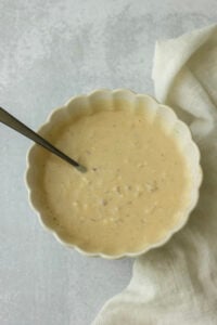 The dressing has been made in a small white bowl.
