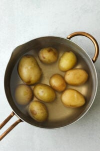 The potatoes have been boiled in a large pot.
