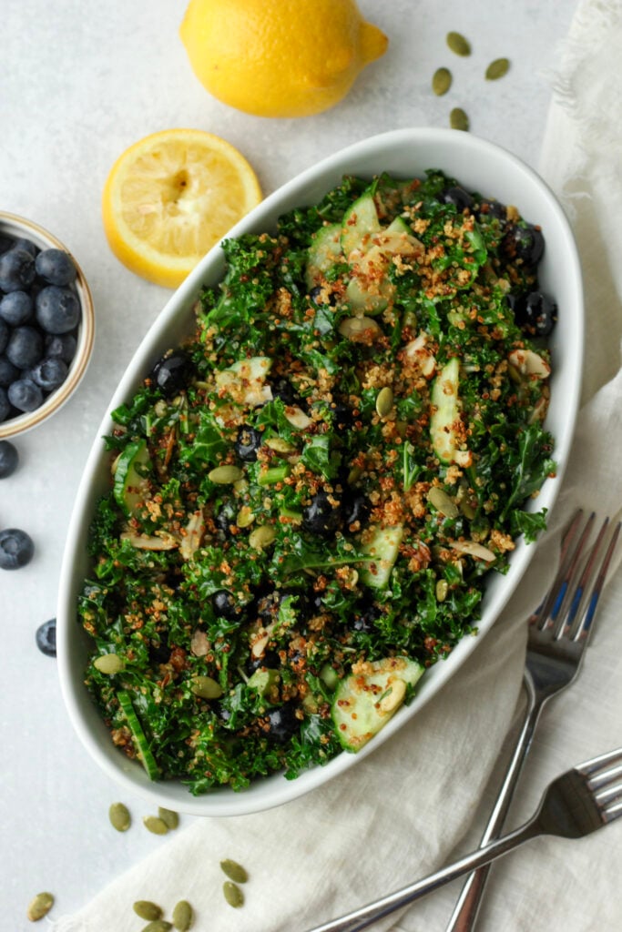 The Healthy Kale Superfood Salad is in a dish ready to serve.