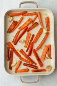The carrots and garlic have been roasted in the oven.