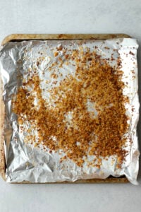 The qunioa has been toasted on a bkaing sheet.