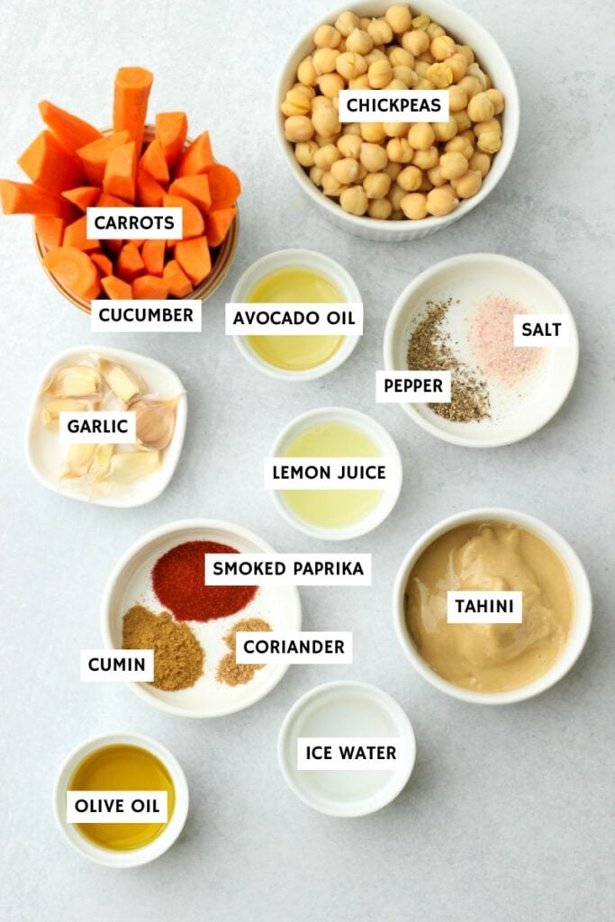 All of the ingredients needed to make this roasted carrot and garlic hummus.