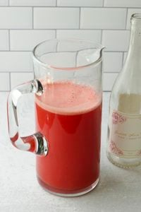 The sparkling water has been added to the pitcher and is ready to serve.