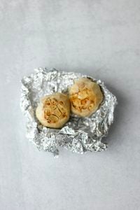 The garlic bulbs have been roasted in tinfoil.