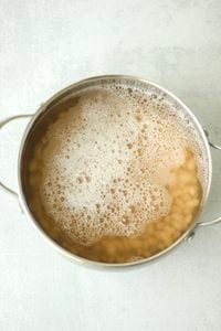 The beans have been boiled in a saucepan.